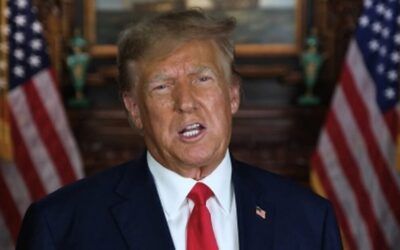 Trump shares NEVER SURRENDER meme with almost 20 guns pointed at his head