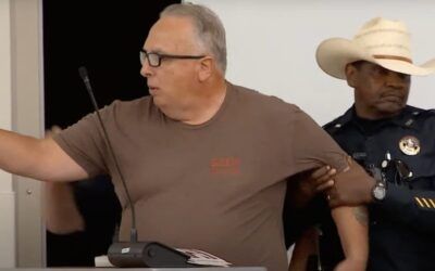 Security forcibly removes man from school board meeting when he starts reading LGBTQ graphic novel