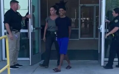 Florida teen charged in fatal shooting of man, 6-year-old girl flashes BIG GRIN during perp walk