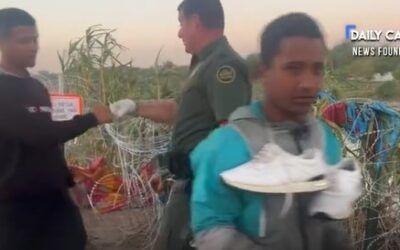 Illegal migrants fist bump Border Patrol agent that cut Abbott’s border wire