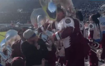 College tuba player punches out obnoxious football fan, while continuing to play – he never missed a beat
