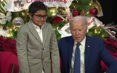 Social media disgusted when Biden plays creepy Santa Claus, invites child to sit on his lap