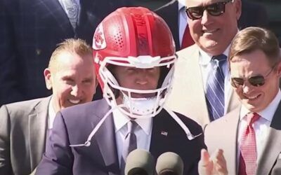 Biden beclowns himself with KC Chiefs helmet during visit by the NFL champs