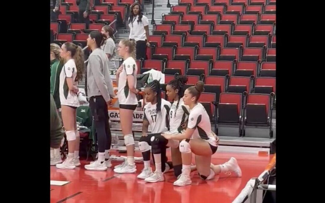 Amid allegations of conspiring with trans athlete, female volleyball player kneels during national anthem