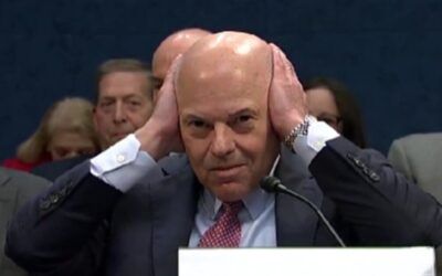 Postmaster General childishly covers his ears during grilling by GOP lawmaker
