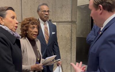 Maxine Waters attempts to force anti-DOGE entourage into HUD office, left watching pro-Trump video in lobby