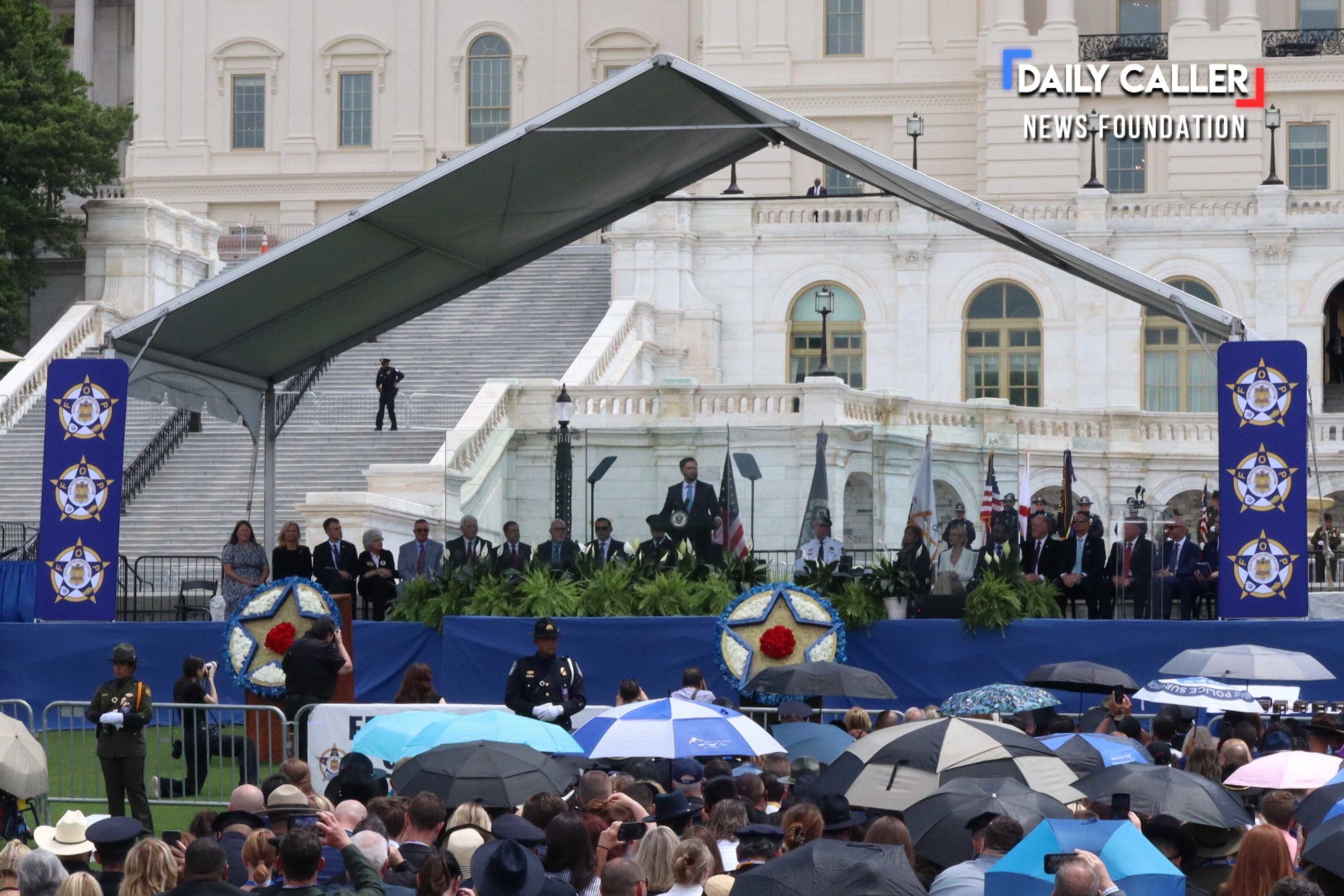 Vice President J.D. Vance speaks onstage with top Trump administration officials seated behind him at the National Peace Officers' Memorial Service on May 15, 2025 in Washington, D.C.