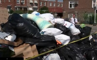 Garbage mountains bury birthplace of America as union demands wage hike