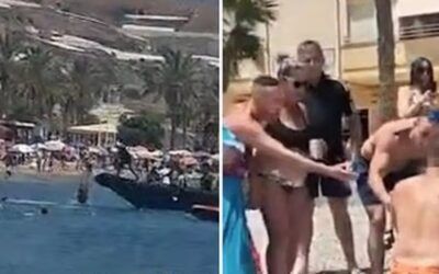Migrant beach brawl: Wild scene as beachgoers tackle, detain boatful of migrants landing on shore
