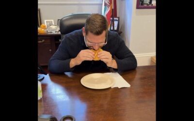 Another painfully unfunny office skit from Eric Swalwell has him eat a hamburger and die