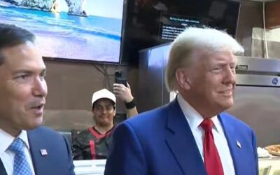 Marco Rubio passes Trump a note with news about Middle East deal