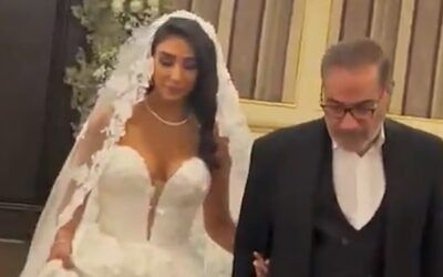Leaked: Iranian ‘enforcer’s’ daughter wears sexy, low-cut wedding dress as women without hijab’s face brutality
