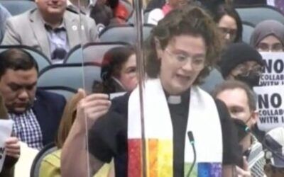 Rainbow-clad female reverend compares ICE supporters to Judas