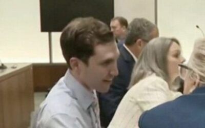 Charlie Kirk’s alleged assassin smirks during first in-person hearing