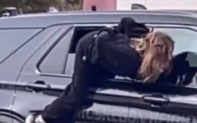 Wild video! Handcuffed woman escapes by wiggling out of cop car’s half opened window