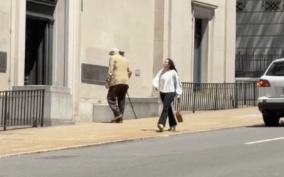 Lone protester bravely defends gerrymandering by pacing angrily in front of Virginia Supreme Court