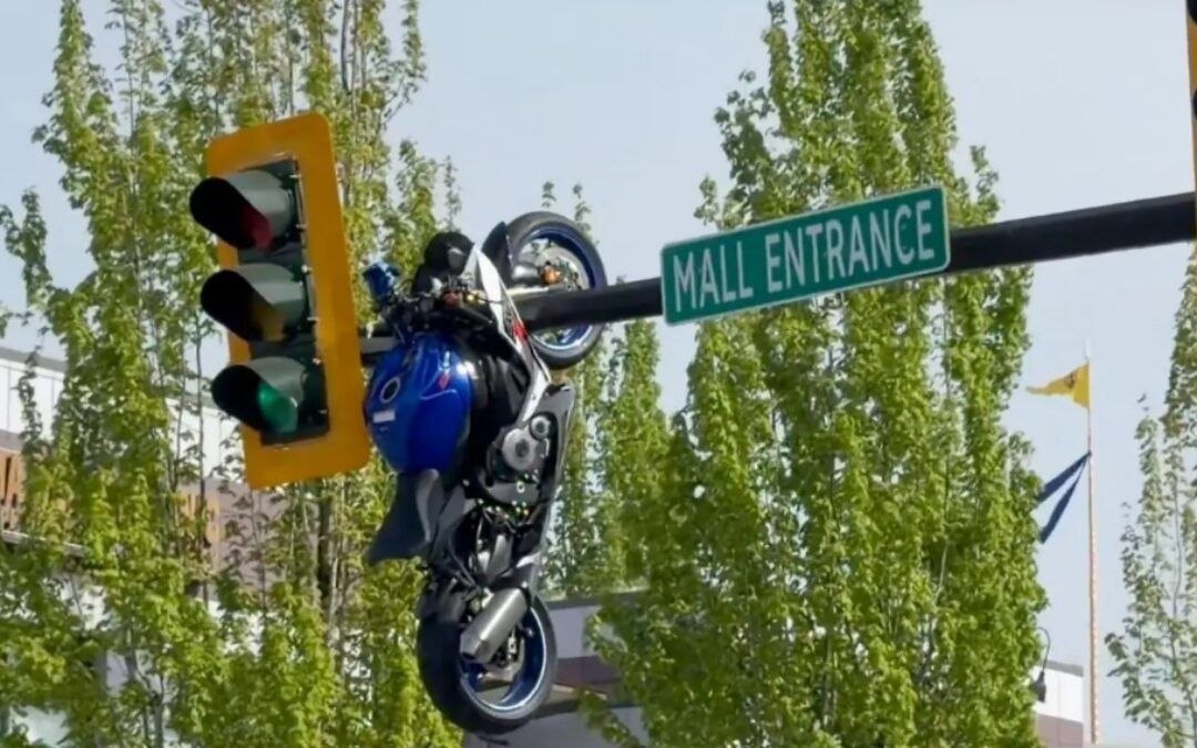 Motorcycle ends up dangling from traffic light, insane wreck footage shows