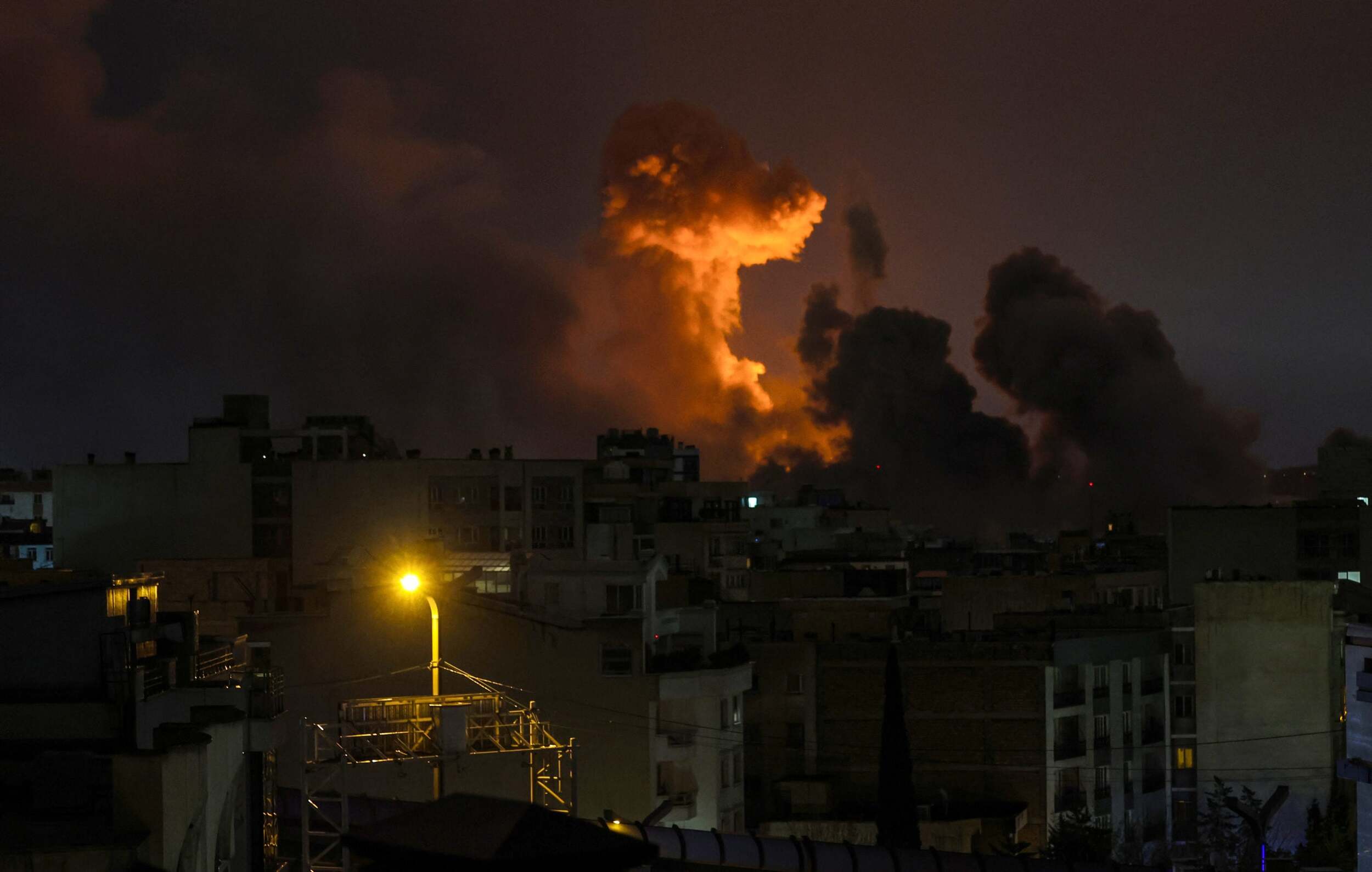 A large plume of smoke rises over Tehran after explosions were reported in the city during the night on March 28, 2026 in Tehran, Iran. (Photo by Getty Images)