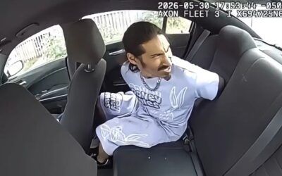 Jail-bound suspect slips cuffs, steals police cruiser takes trapped officer on wild ride